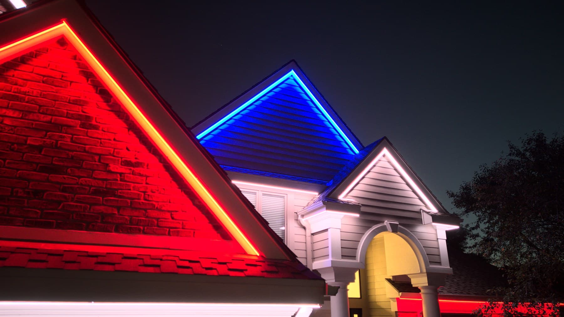 Close view of two Omaha gables with the channel following the rake line to the peak, one gable red and one blue