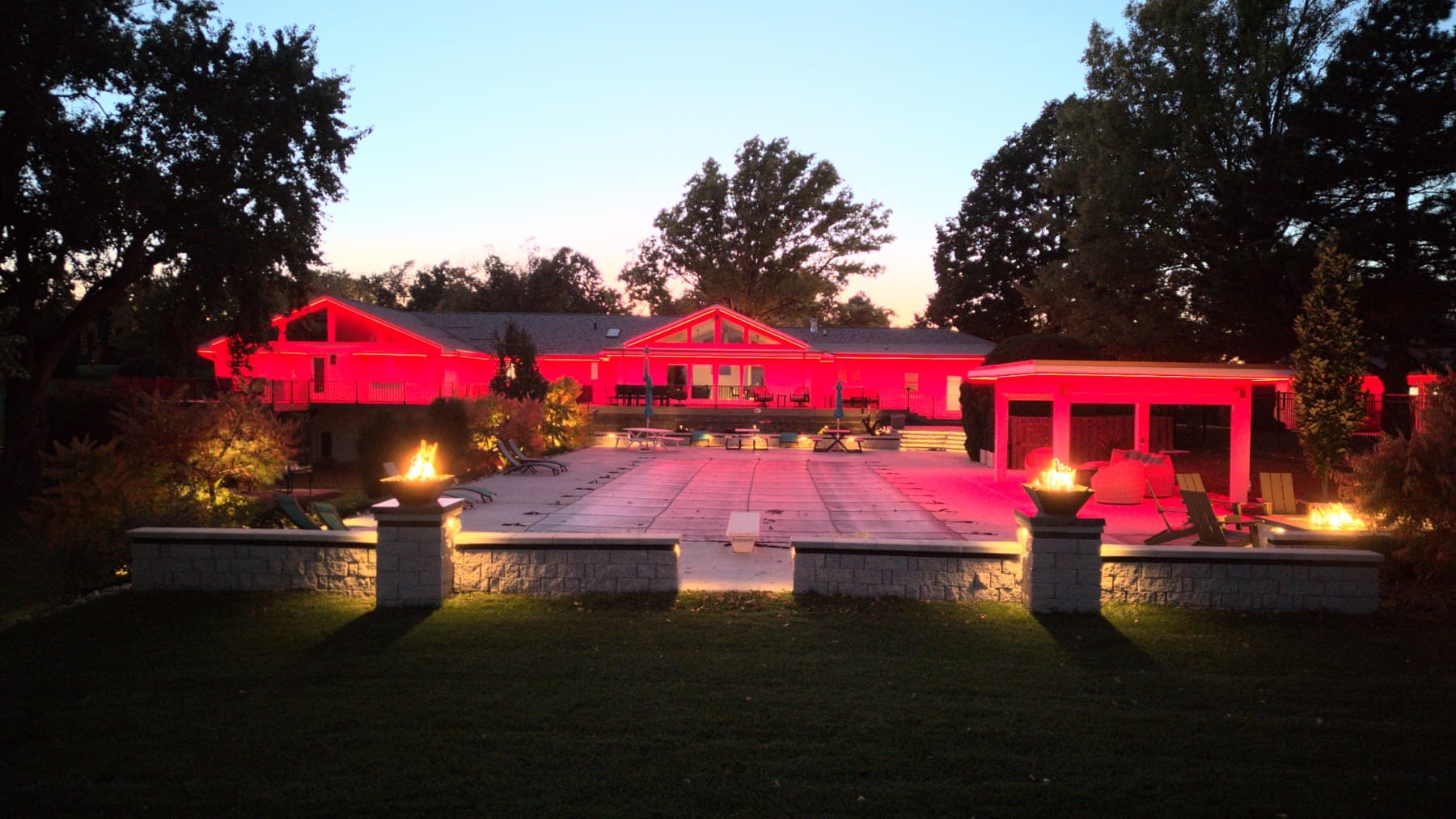 The same Omaha home, pergola and pool deck with every run switched to red
