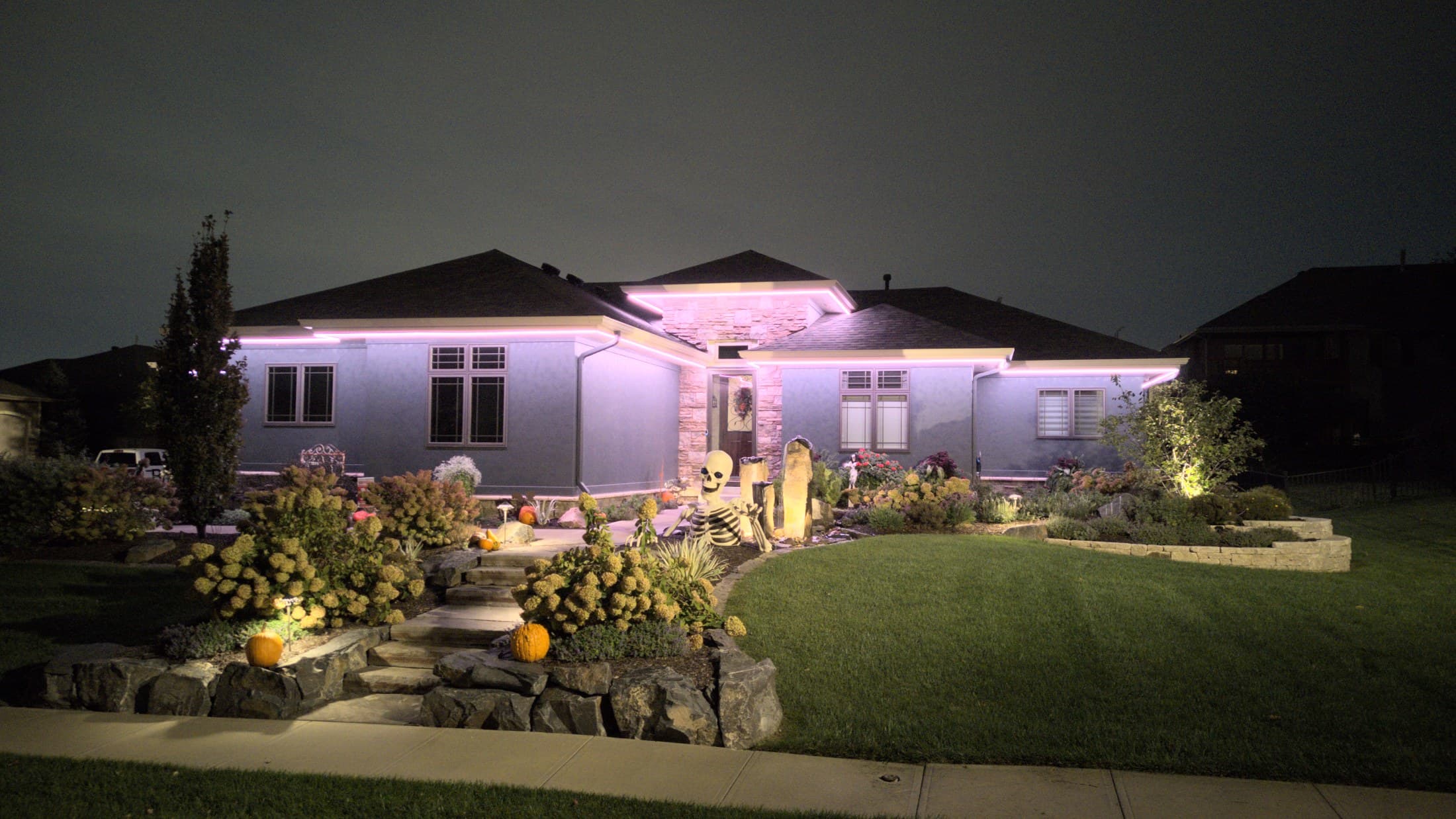 An Omaha home washed violet for Halloween
