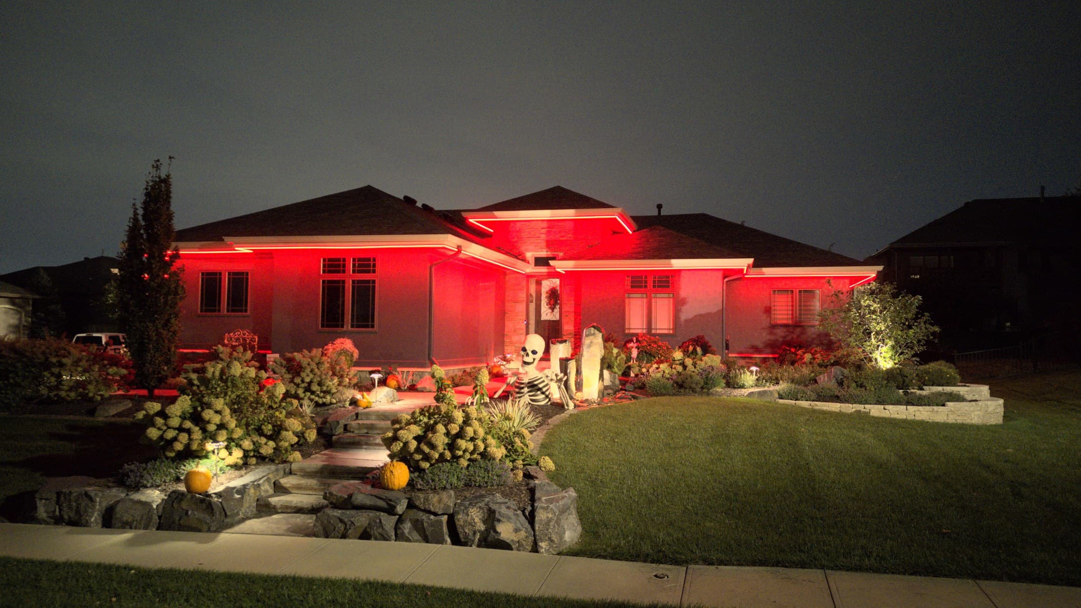 An Omaha ranch home with its roofline in scarlet for a Nebraska game day
