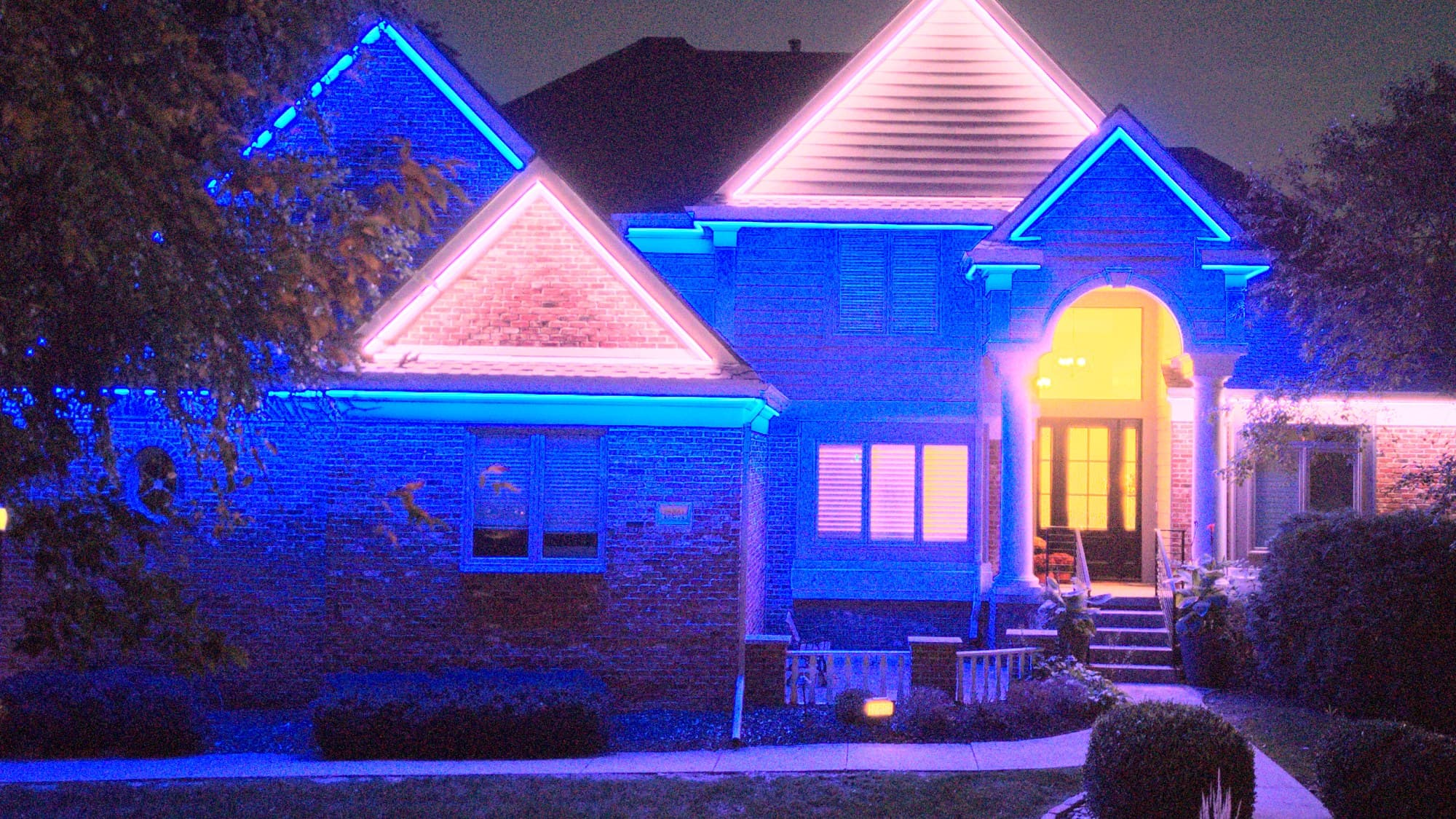 Soffit and eave lighting on an Omaha home, gables in color and eaves left white